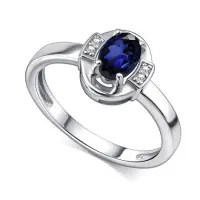Кольцо из серебра с сапфиром и фианитами Кольцо из серебра с сапфиром и фианитами