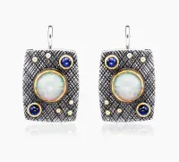 Серебряные серьги с опалом и корундом