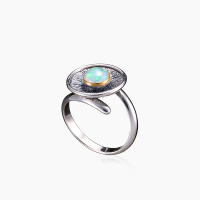 Серебряное кольцо «Небесный Диск» с опалом Серебряное кольцо «Небесный Диск» с опалом