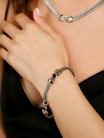 Серебряный браслет с гранатом и золотом